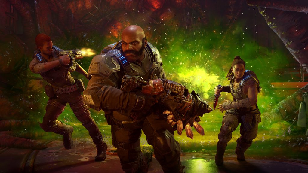 The Hivebuster squad run towards the camera, away from an encroaching green venom. Keegan, center, holds a Claw Rifle. Lahni, right, holds a serrated knife. Mac, left, shoots a pistol over his shoulder at an unseen enemy.